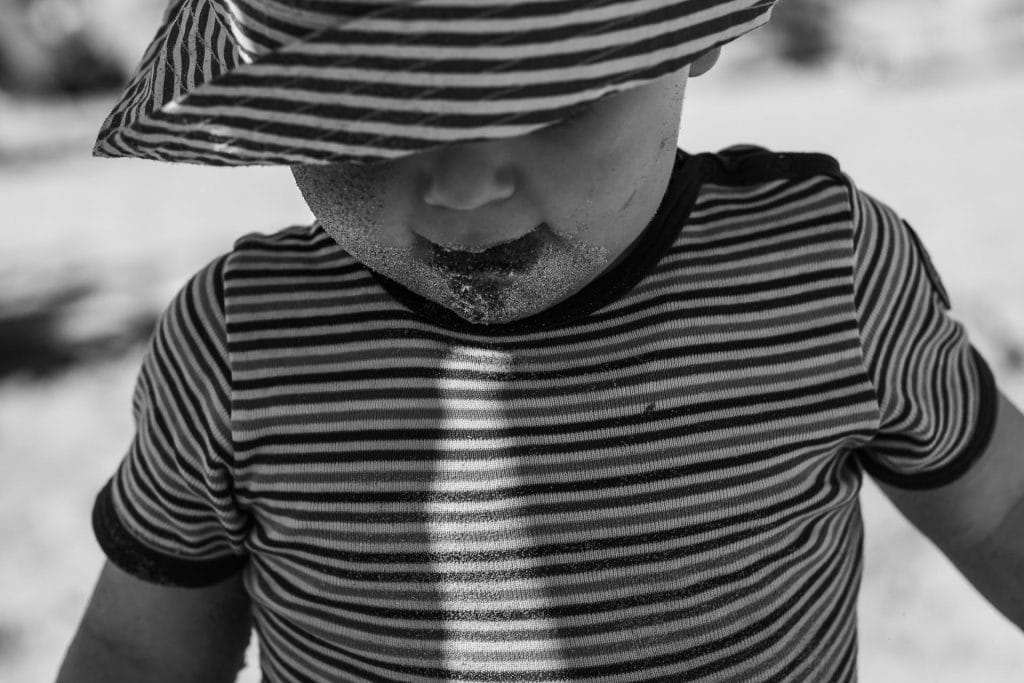 Kinderfoto von einem Kind am Strand